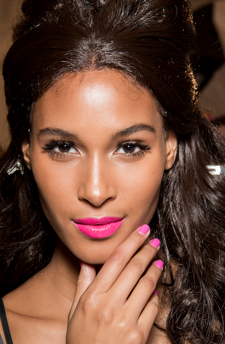 model with pink lipstick and matching nails